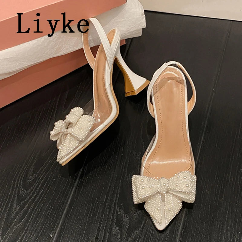 Liyke Summer Fashion Party Dress Slingback Shoes Pearl Bowknot Women Pumps Sexy Pointed Toe White High Heels Transparent Sandals